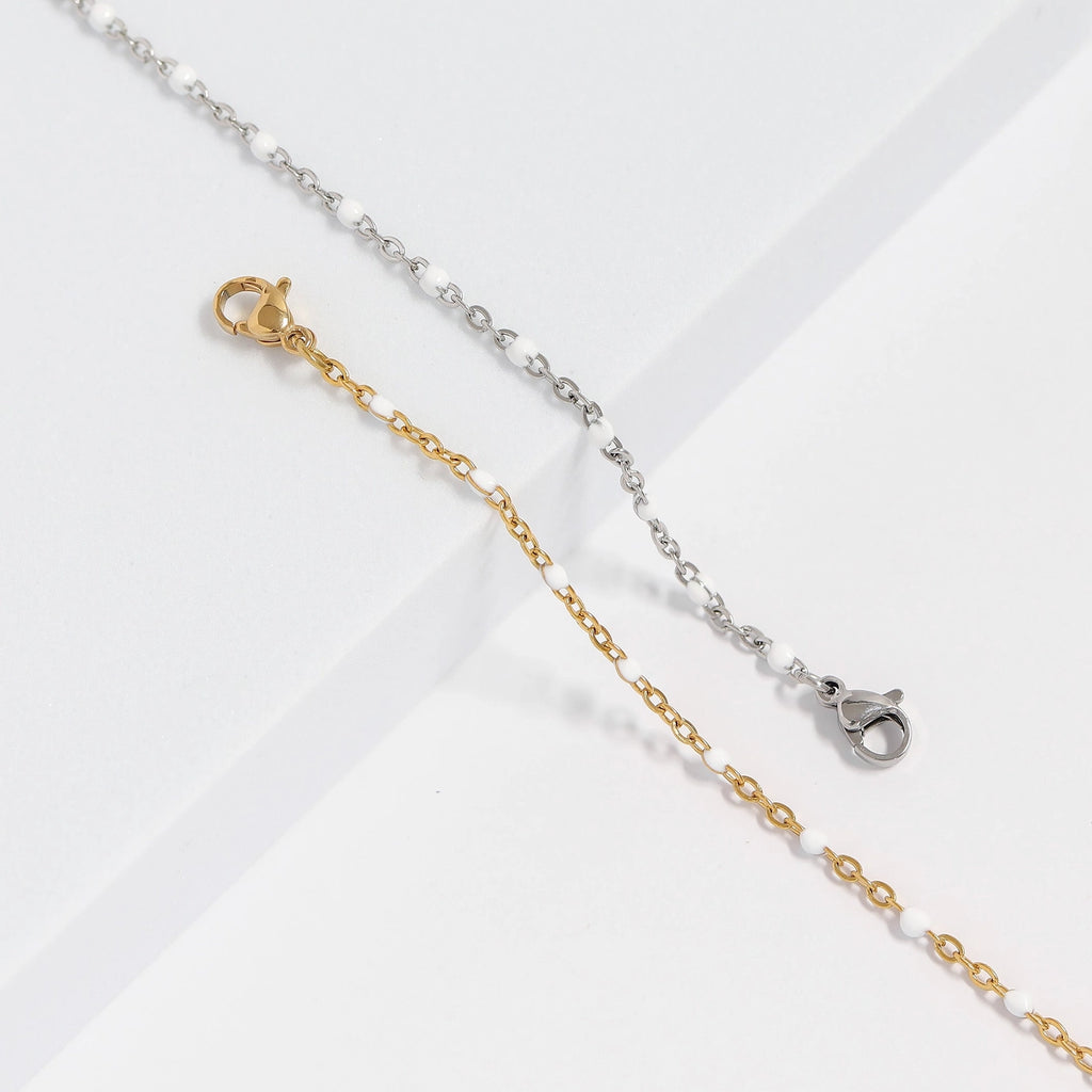 Bracelets Confetti Blanc doré et argenté avec détails en émail blanc